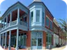 The Direct Pediatrics office at Norton Commons, a brick corner building with a blue two-story porch.